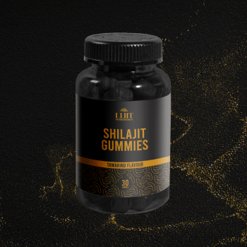 Bottle of Shilajit Gummies with a black and gold label on a dark background